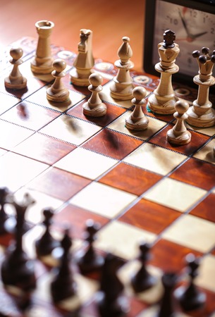 chessboard, clock and figures, from above and verticalの写真素材