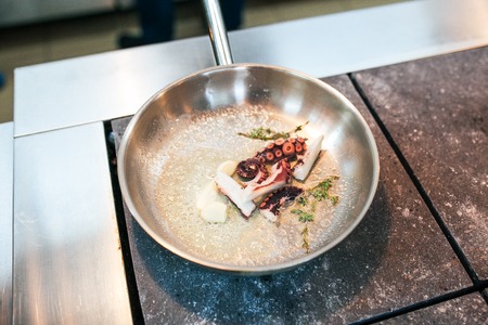 preparing  sea food in the kitchen on panの写真素材