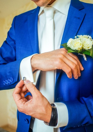 man in a blue suit, hands with studの写真素材