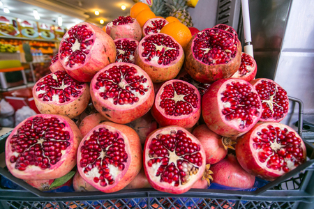 Closeup cut pomegranates on counterの写真素材