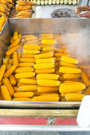 Corn prepared to be put a barbecue at the street marketの写真素材
