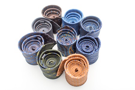 CLose-up rolled isolated modern ties with different patterns  on white backgroundの写真素材