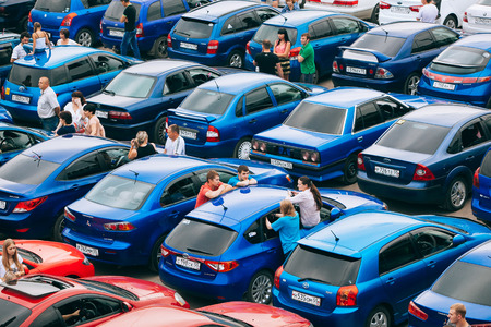 Omsk, Russia - August 22, 2014:  Auto flashmob. Close up view of red and blue carsのeditorial素材