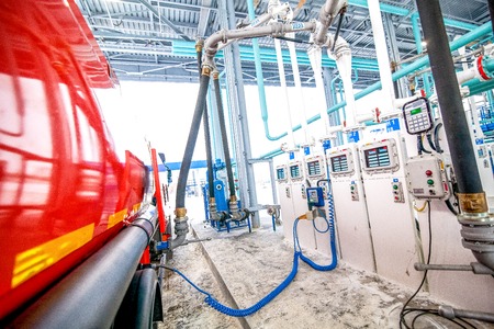 gas station for trucks at oil refinery factory tank filling on truck