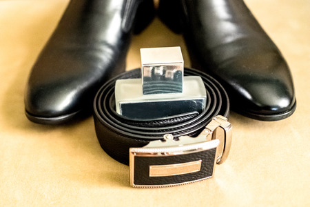 men's black stylish accessories - shoes, leather belt and perfumeの写真素材