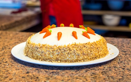 cooking homemade sponge cake  decorating with nutsの写真素材