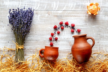 still life pottery and lavender - country life with berries on wooden backgroundの写真素材