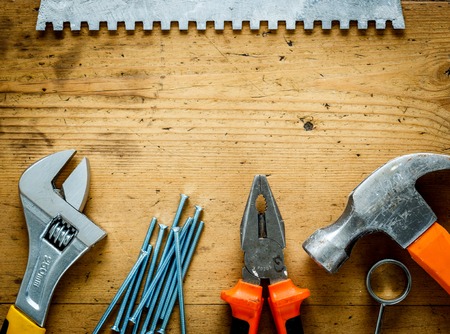 construction tools on a wooden table top viewの写真素材