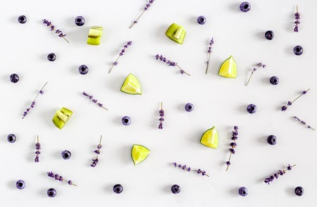 Colorful pattern made of berries with lavender on white backround top viewの写真素材