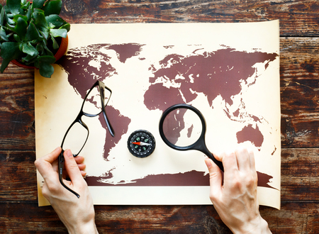 world map on a wooden table time to travelの写真素材