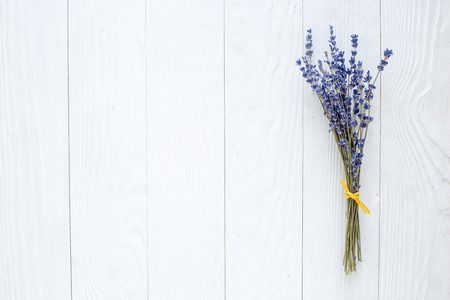bouquet of dried lavender on white wooden table top viewの写真素材