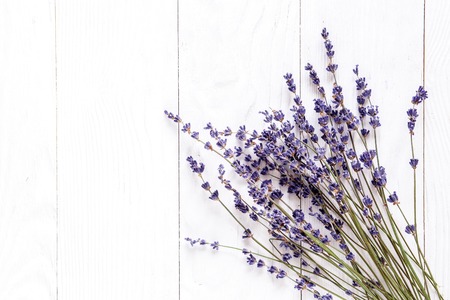 bouquet of dried lavender on white wooden table top view, mock-upの写真素材