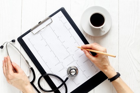 doctor workplace with a stethoscope and hands top viewの写真素材