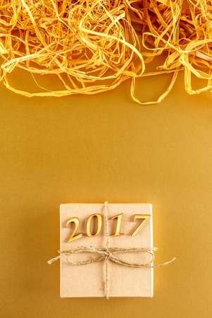 golden paper texture for Christmas, New Year 2017 with space for text.