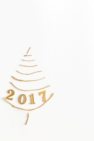 Simple christmas tree made from pieces of rope on white - original new year cardの写真素材