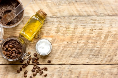 Body scrub of ground coffee top view on wooden table.の写真素材