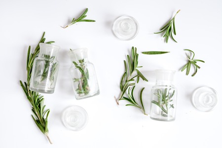 fresh rosemary with bottle on white background top view.の写真素材