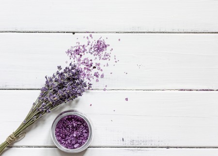 lavender bath salt on wooden table top view.の写真素材