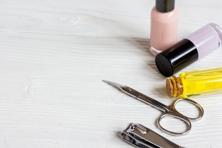 nail polish and manicure set on wooden background close up