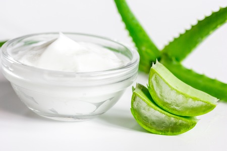 aloe vera - leaves and cream isolated on white background macroの写真素材