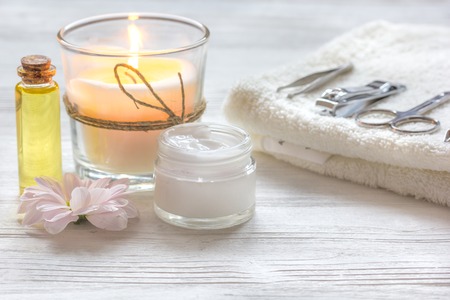 spa nail care with aroma candle, flower on wooden backgroundの写真素材