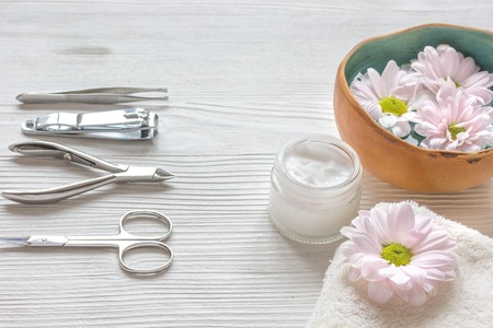 oil and cream for nail care in spa on wooden backgroundの写真素材