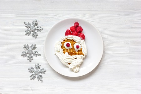 kids menu Christmas breakfast waffles top view on wooden backgroundの写真素材