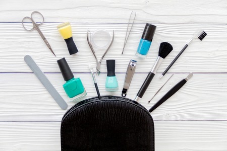 manicure set and nail polish on wooden background top viewの写真素材