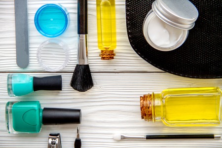 set for manicure and make-up on wooden background top viewの写真素材