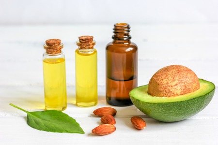 avocado oil for handmade cosmetics on wooden background close upの写真素材