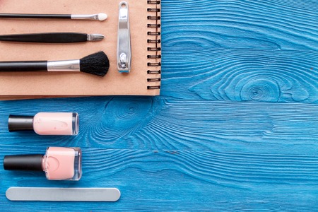 cosmetic and manicure set on dark wooden background top viewの写真素材