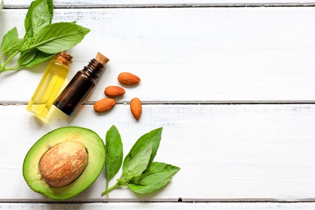 avocado oil for handmade cosmetics on wooden background top viewの写真素材