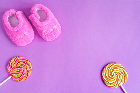 birth of child - baby's bootees on purple background top viewの写真素材