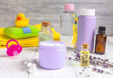 set baby care for bathroom with lavender on wooden backgroundの写真素材