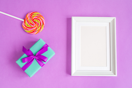 birth of child - blank picture frame on purple background top viewの写真素材