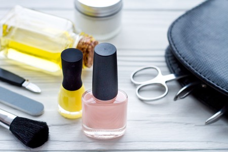 cosmetic and manicure set on wooden background.の写真素材