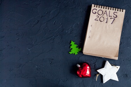 notebook and goals for new 2017 year on dark background top viewの写真素材