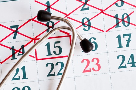 record to the doctor - calendar wit stethoscope top view.の写真素材
