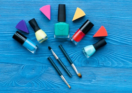 decorative cosmetics on dark wooden background top viewの写真素材