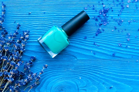 decorative cosmetics with lavender on dark wooden background top viewの写真素材