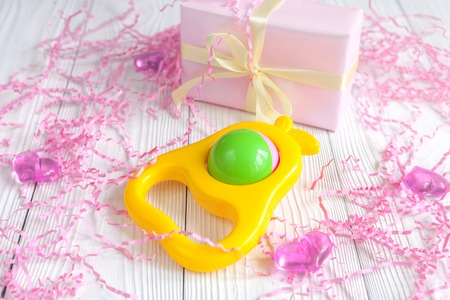 birth of baby - boxes for gifts on wooden background.