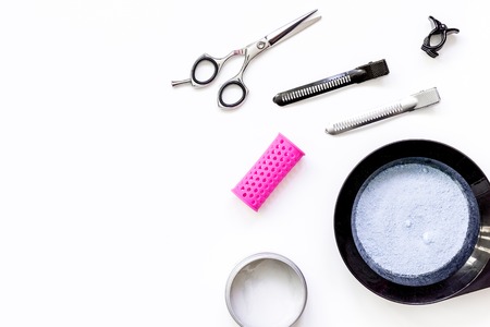 Tools for hair dye and hairdye top view on white backgroundの写真素材