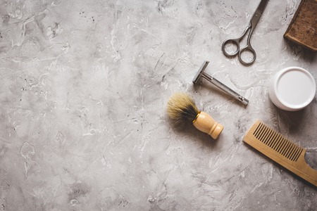 Mens hairdressing desktop with tools for shaving top view.