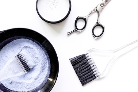 Tools for hair dye and hairdye top view on white backgroundの写真素材