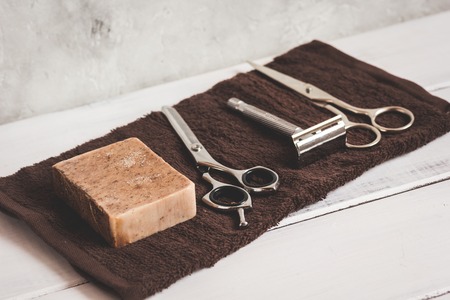Mens hairdressing wooden desktop with tools close upの写真素材