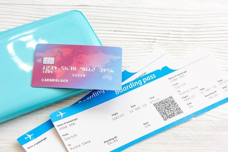 passport, credit card, tickets on wooden background close upの写真素材