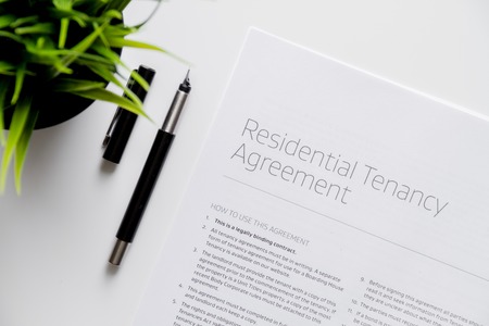 signing of agreement top view on white background.