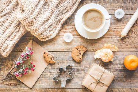 Christmas evening with cup of cocoa on wooden background top viewの写真素材