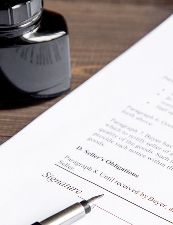 concept conclusion of treaty on dark wooden background close up