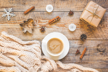 Christmas muffler with cup of cocoa on wooden background top viewの写真素材
